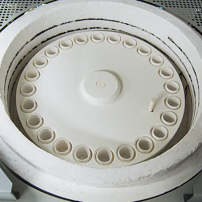 Furnace carousel with the furnace lid open for easy access to crucible positions. Furnace carousel with the furnace lid open for easy access to crucible positions.